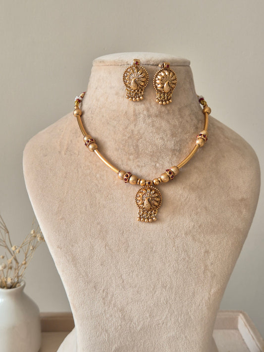 Gold beaded necklace with pendant, Shanaya by Naitri, displayed on white background.