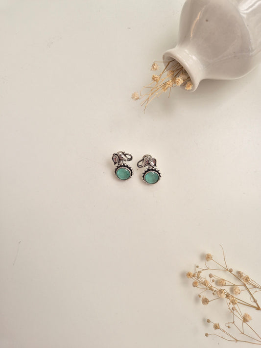 Handcrafted oxidized Kiara Earrings with silver and green accents, perfect for festive or casual.