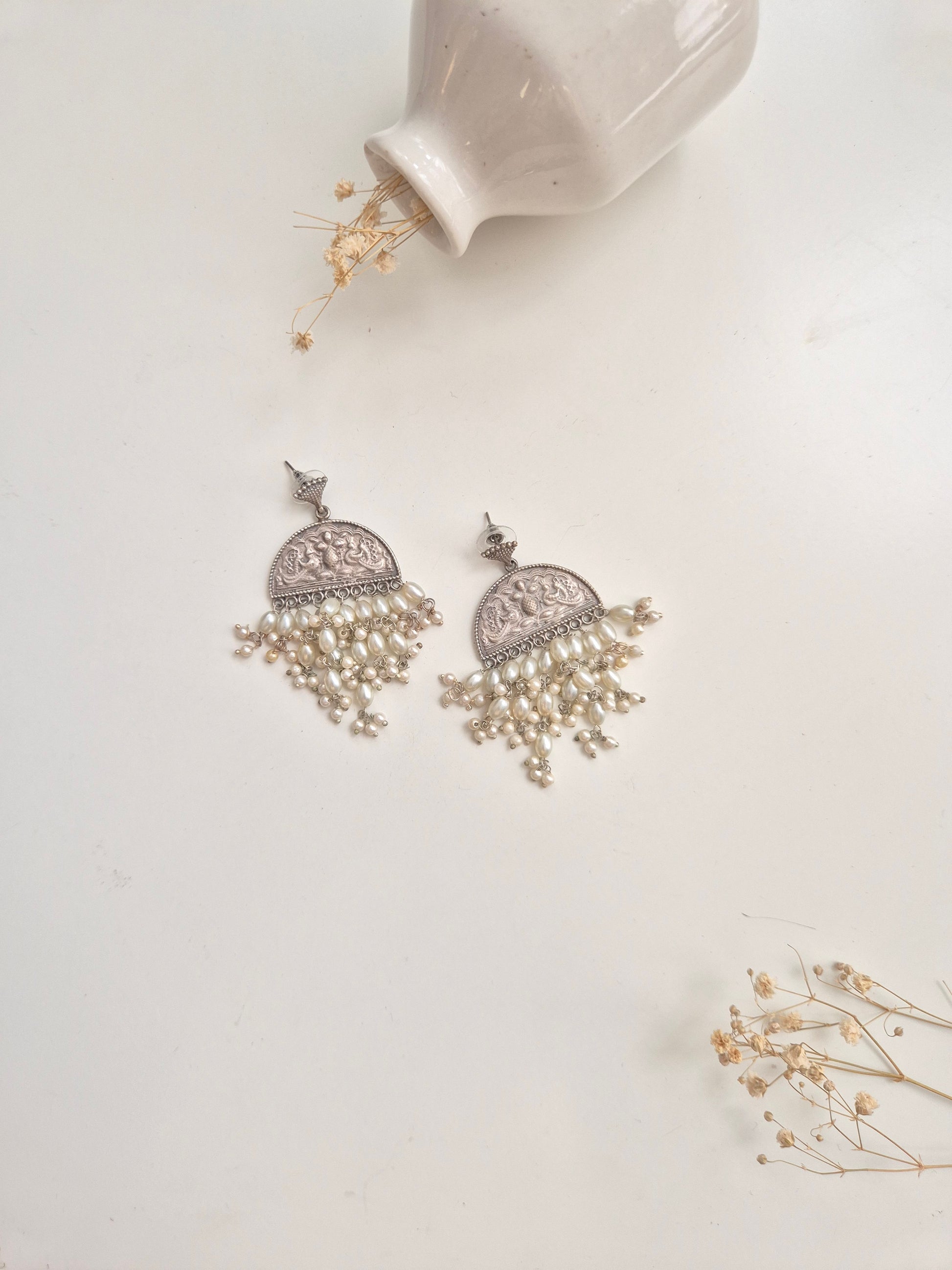 Elegant handcrafted oxidized Darshita Earrings, silver and red dangle style.
