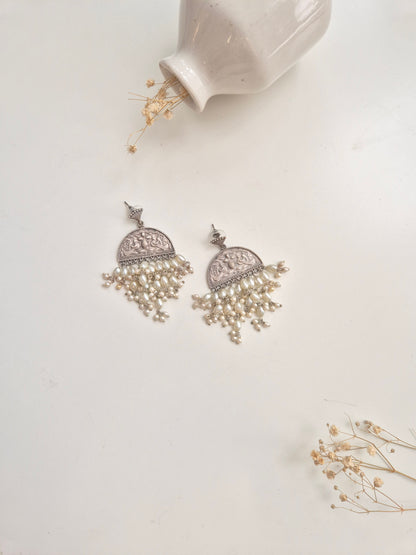 Elegant handcrafted oxidized Darshita Earrings, silver and red dangle style.