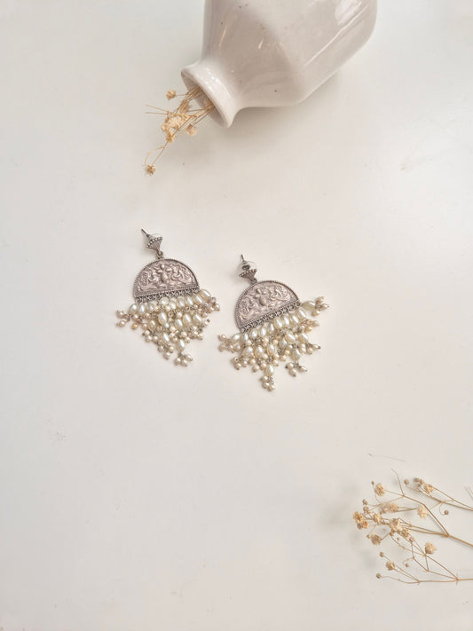 Elegant handcrafted oxidized Darshita Earrings, silver and red dangle style.