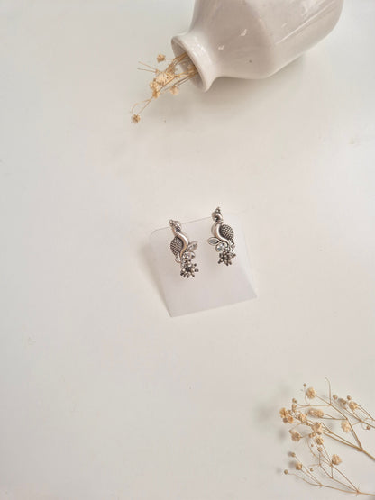 Premium handcrafted oxidized Hemal Earrings with silver and red dangle design.