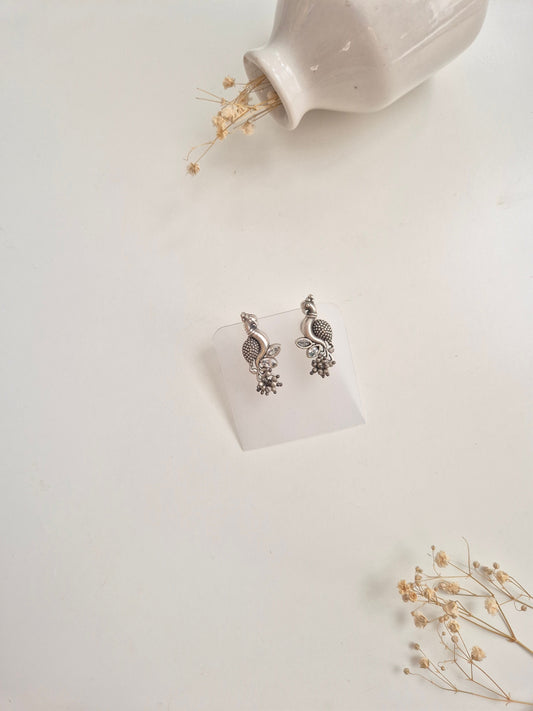 Premium handcrafted oxidized Hemal Earrings with silver and red dangle design.