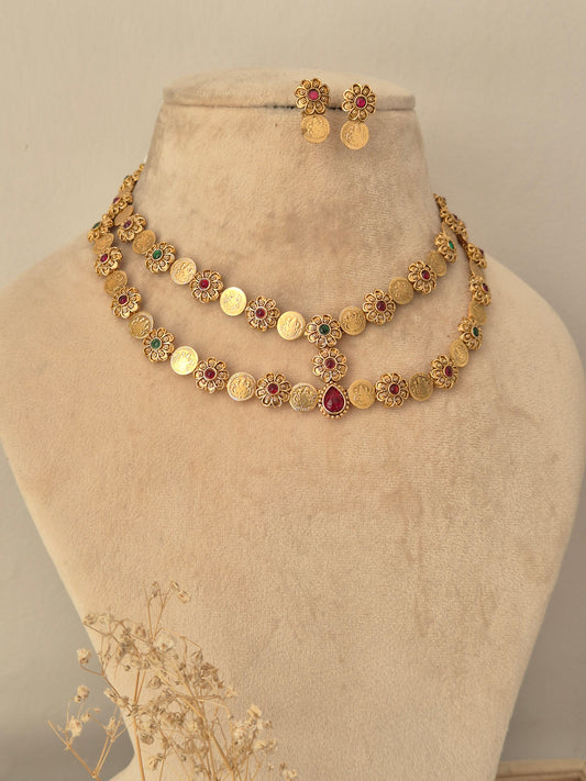Gold-toned Yamya necklace set with red and green stones and matching earrings.