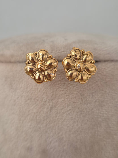 Gold-toned floral stud earrings with a textured petal design from the Lekhani necklace set