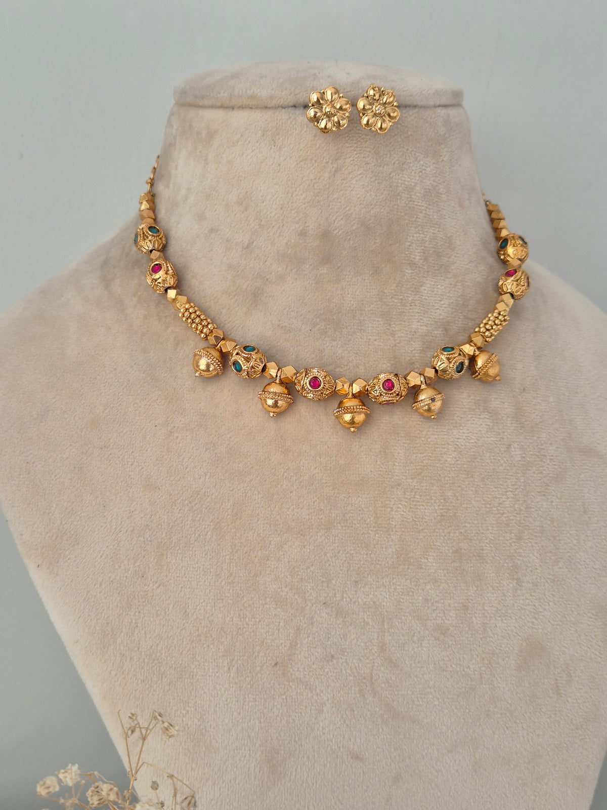 Lekhani traditional gold-toned ethnic necklace with colorful stone details and matching stud earrings