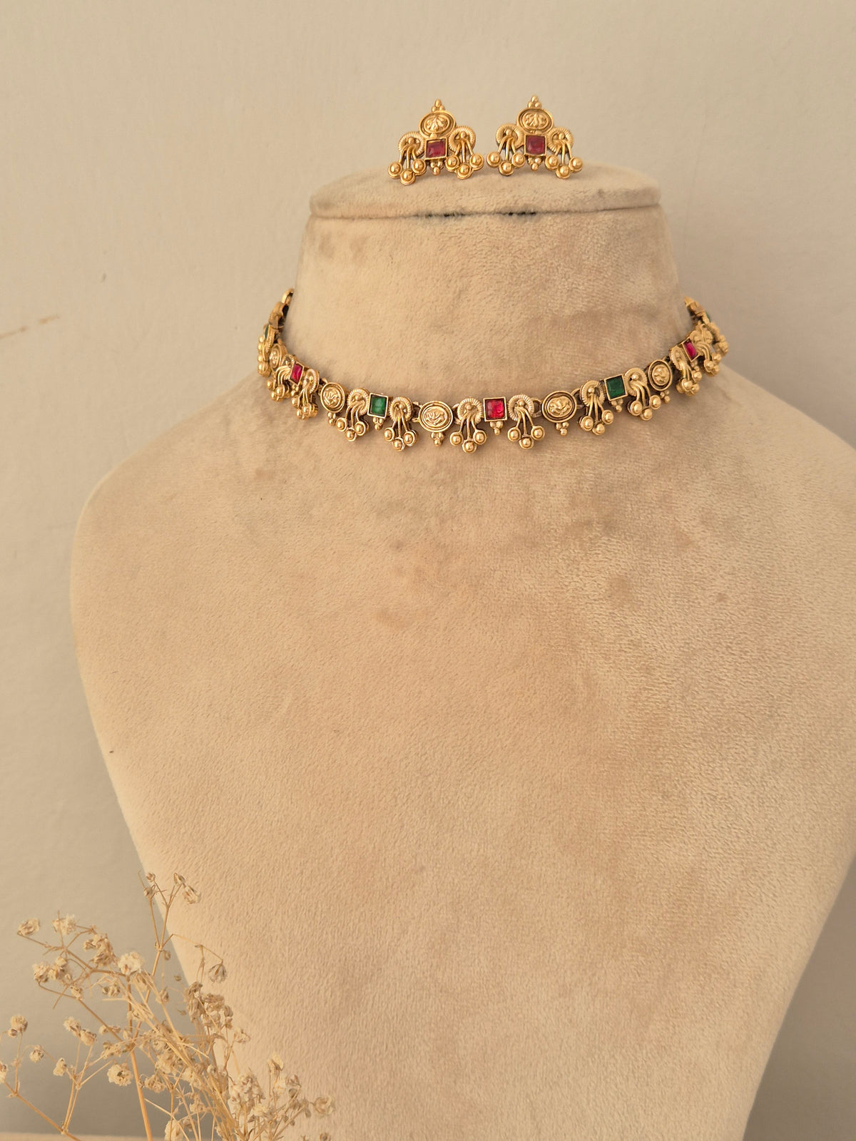 Naitri Waari Necklace Set in gold brass alloy decorated with multicolored stone embellishments