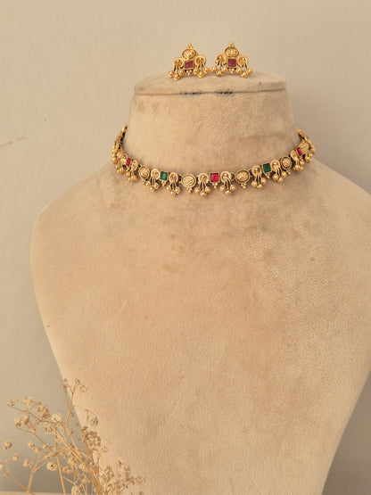 Naitri Waari Necklace Set in gold brass alloy decorated with multicolored stone embellishments