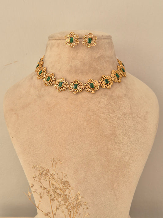 Gold-toned Umrah choker necklace set featuring floral filigree openwork patterns centered with rectangular green stones