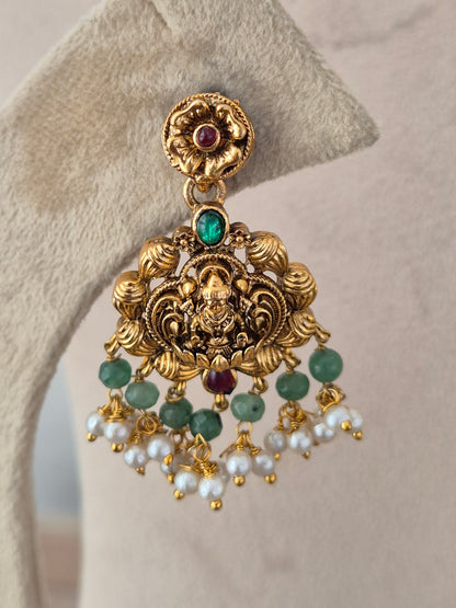Naitri Waraya Collection matching gold-tone temple earring with deity motif and green stone