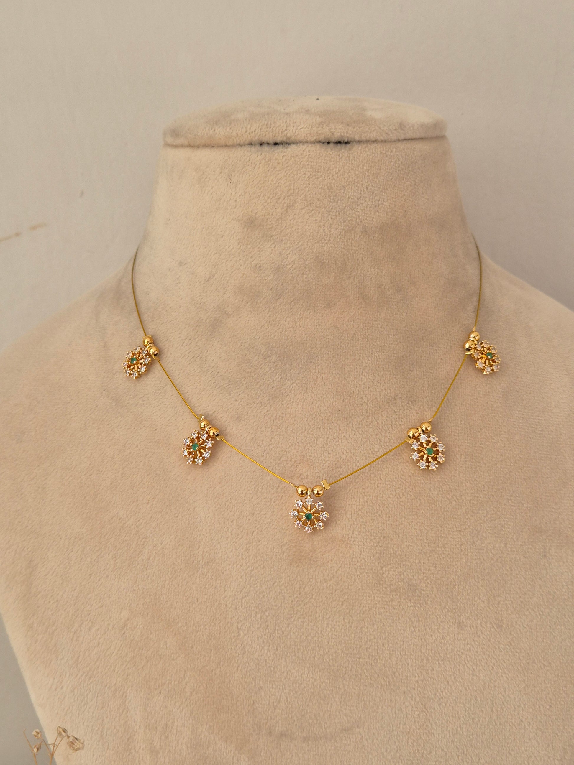 Naitri Zovi Invisible Chain Necklace with floral stone-embellished station charms