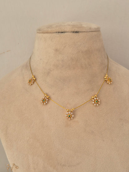 Naitri Zovi Invisible Chain Necklace with floral stone-embellished station charms
