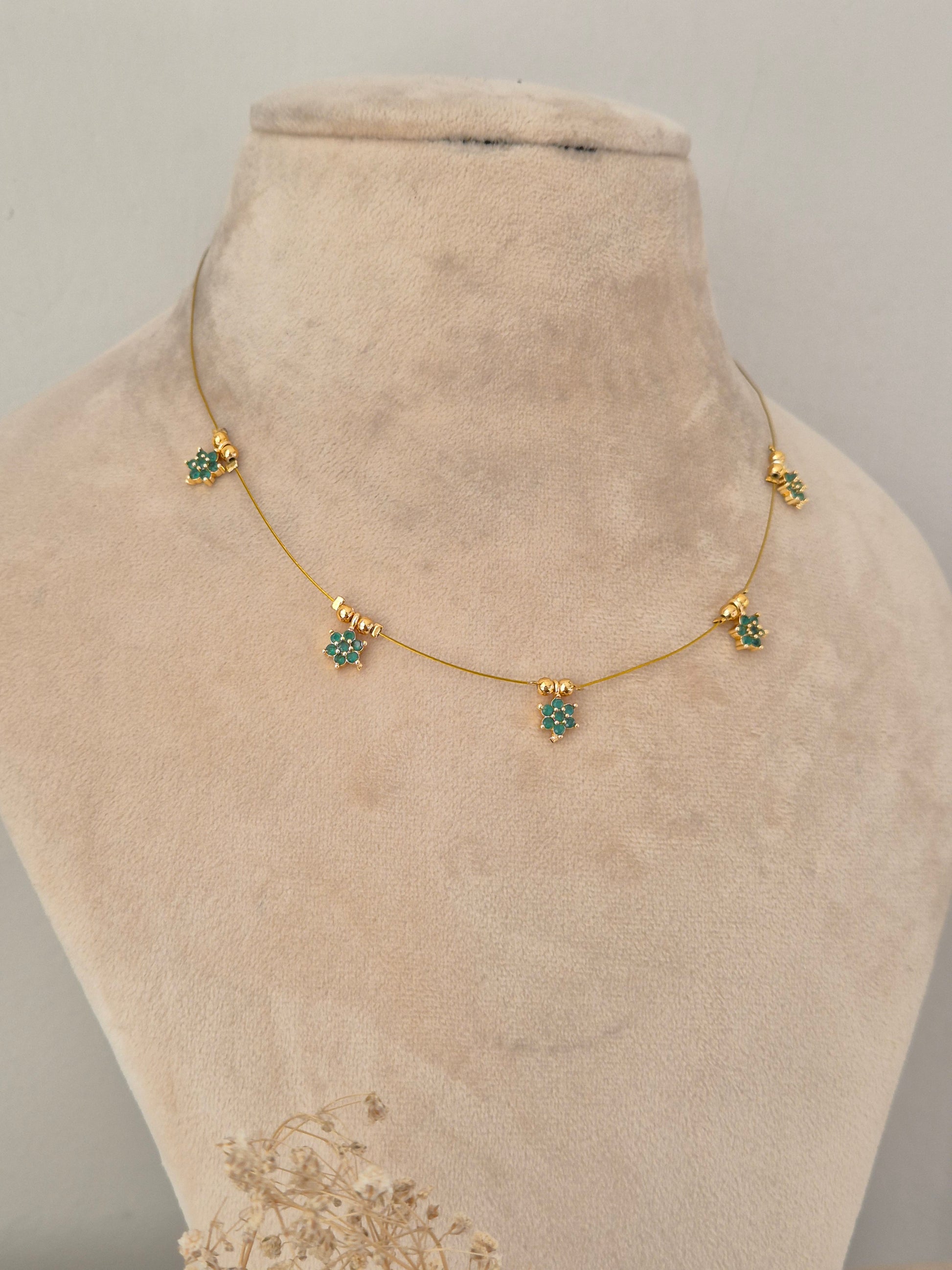 Naitri Chetika Invisible Chain Necklace featuring gold-tone brass alloy craftsmanship with green stone details