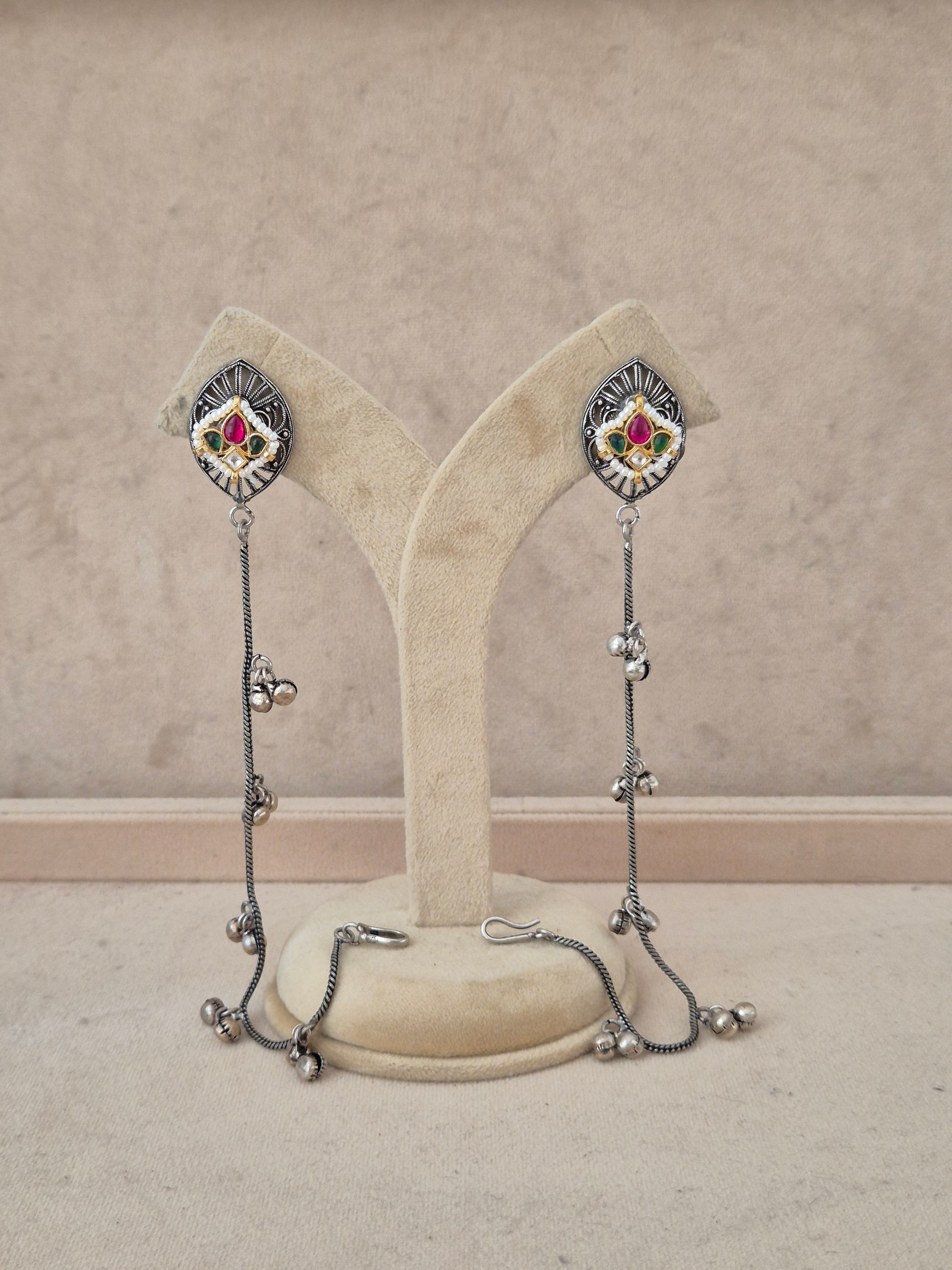 Naitri Anokhi Earrings handcrafted in oxidized silver alloy with vibrant stone work and tassel details