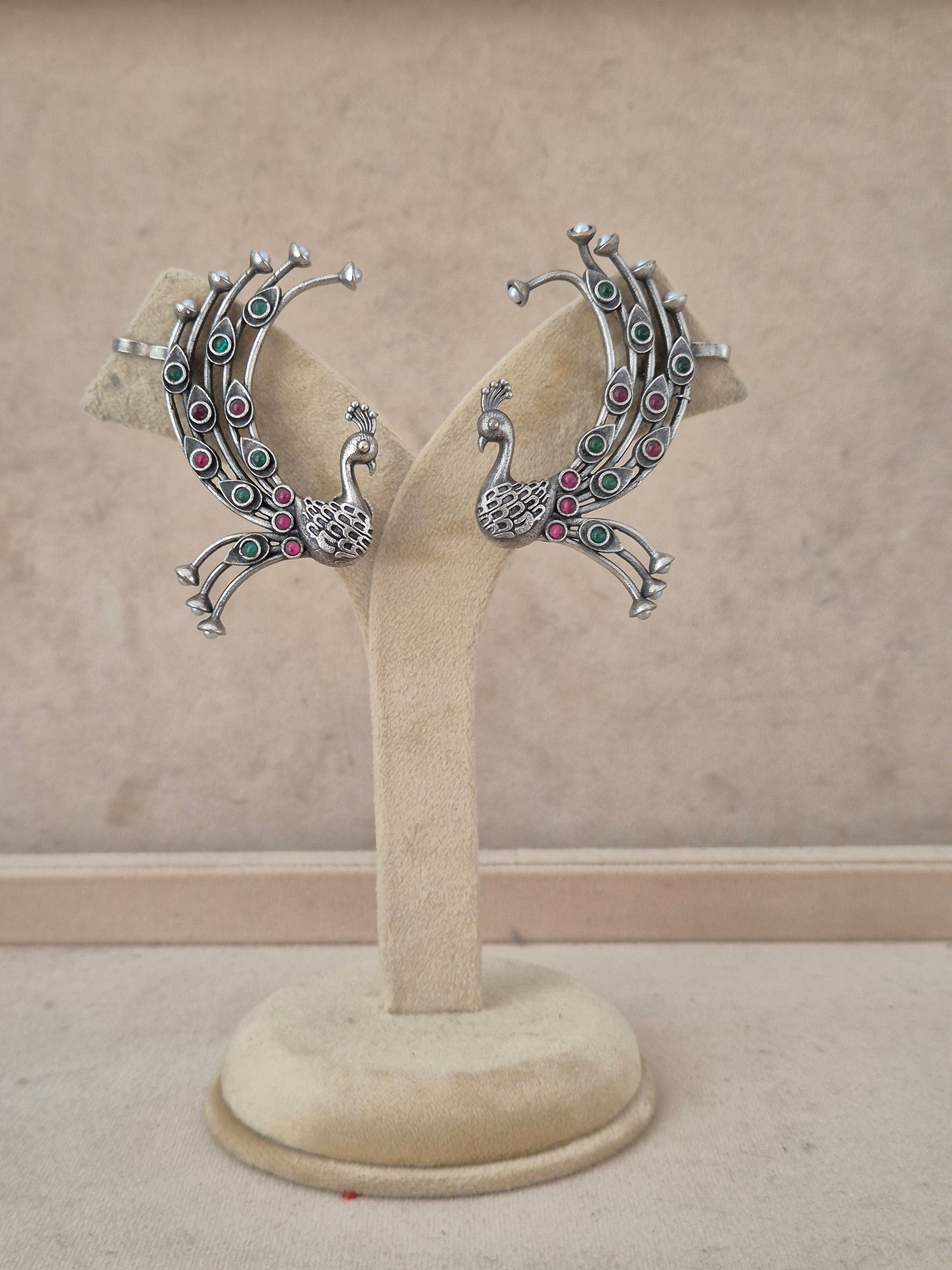 Handcrafted oxidized silver peacock ear cuffs featuring pink and green stone accents