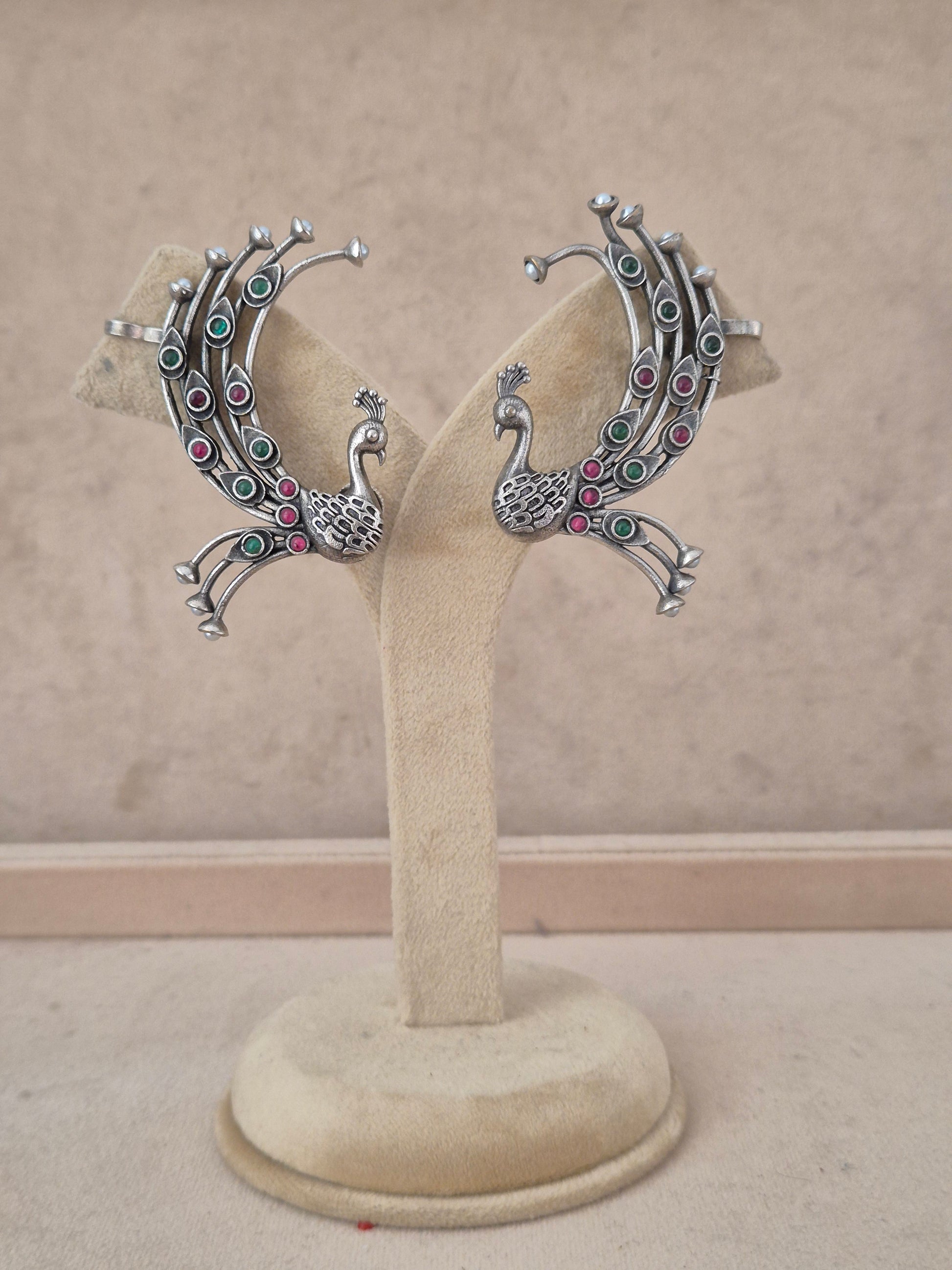Ethnic oxidized silver peacock statement earrings with pink and green stone details