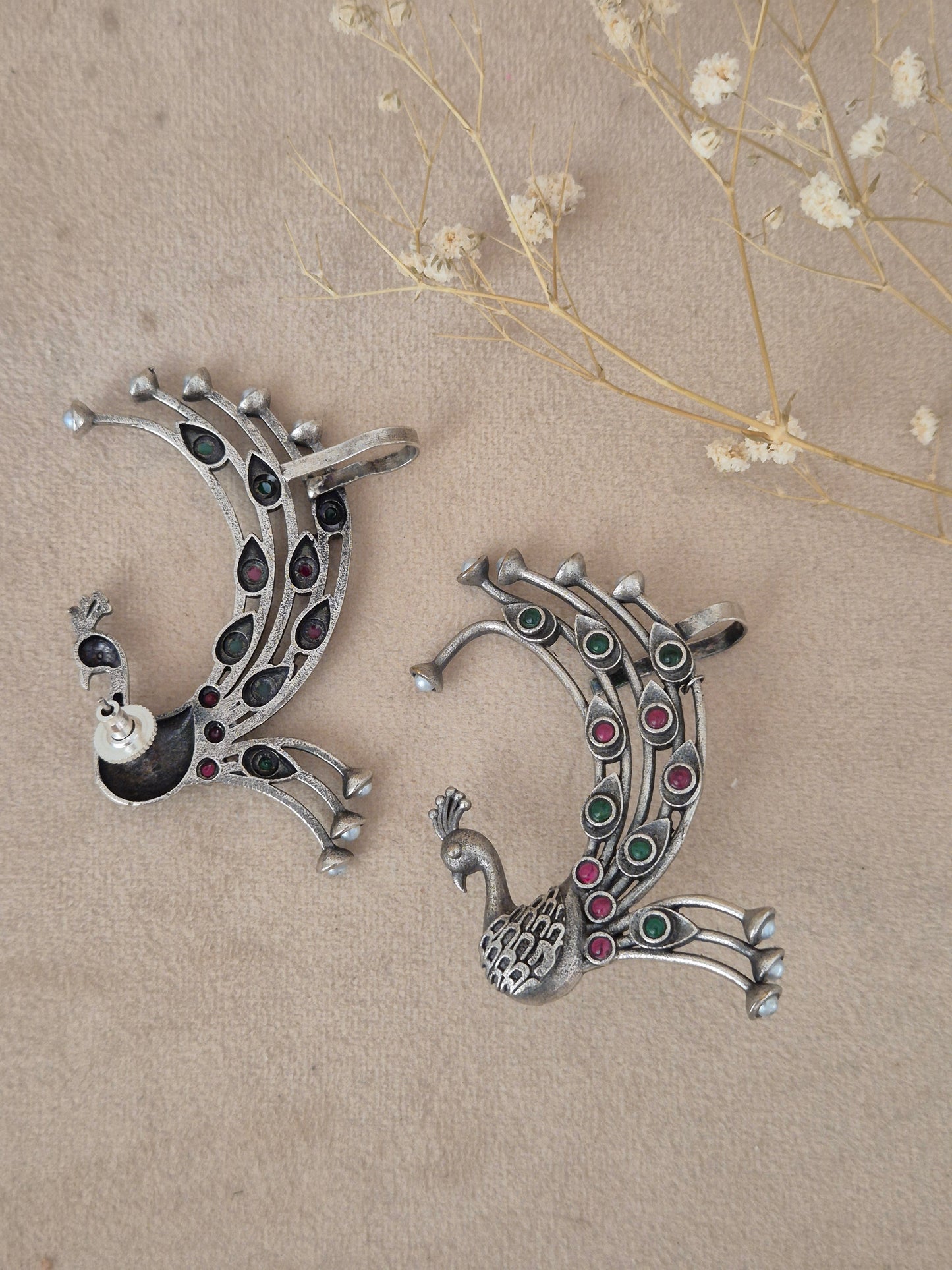Naitri Bhanuja Earrings in handcrafted oxidized silver alloy featuring a detailed peacock motif and colorful stone work