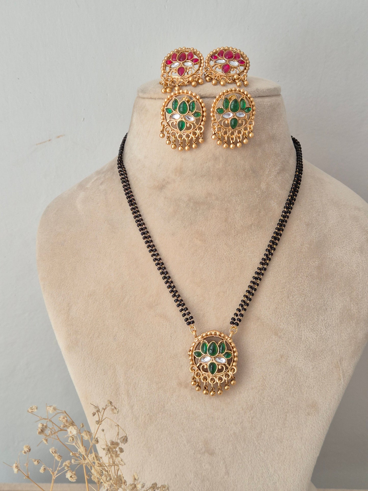 eversible Ladita Mangalsutra set with round green and pink stone pendant, matching earrings, and black beads chain by Naitri