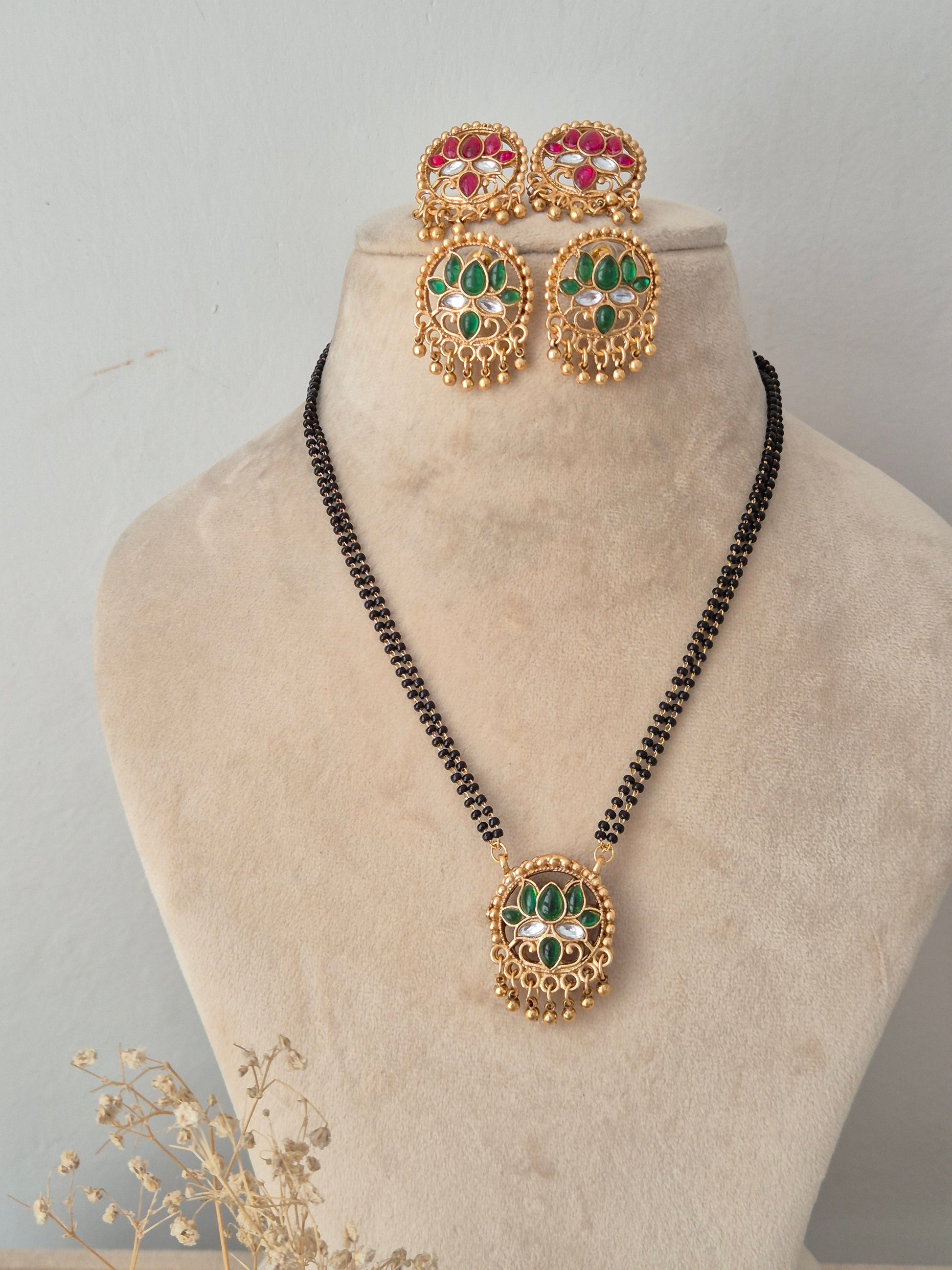 eversible Ladita Mangalsutra set with round green and pink stone pendant, matching earrings, and black beads chain by Naitri
