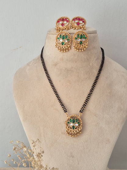 eversible Ladita Mangalsutra set with round green and pink stone pendant, matching earrings, and black beads chain by Naitri