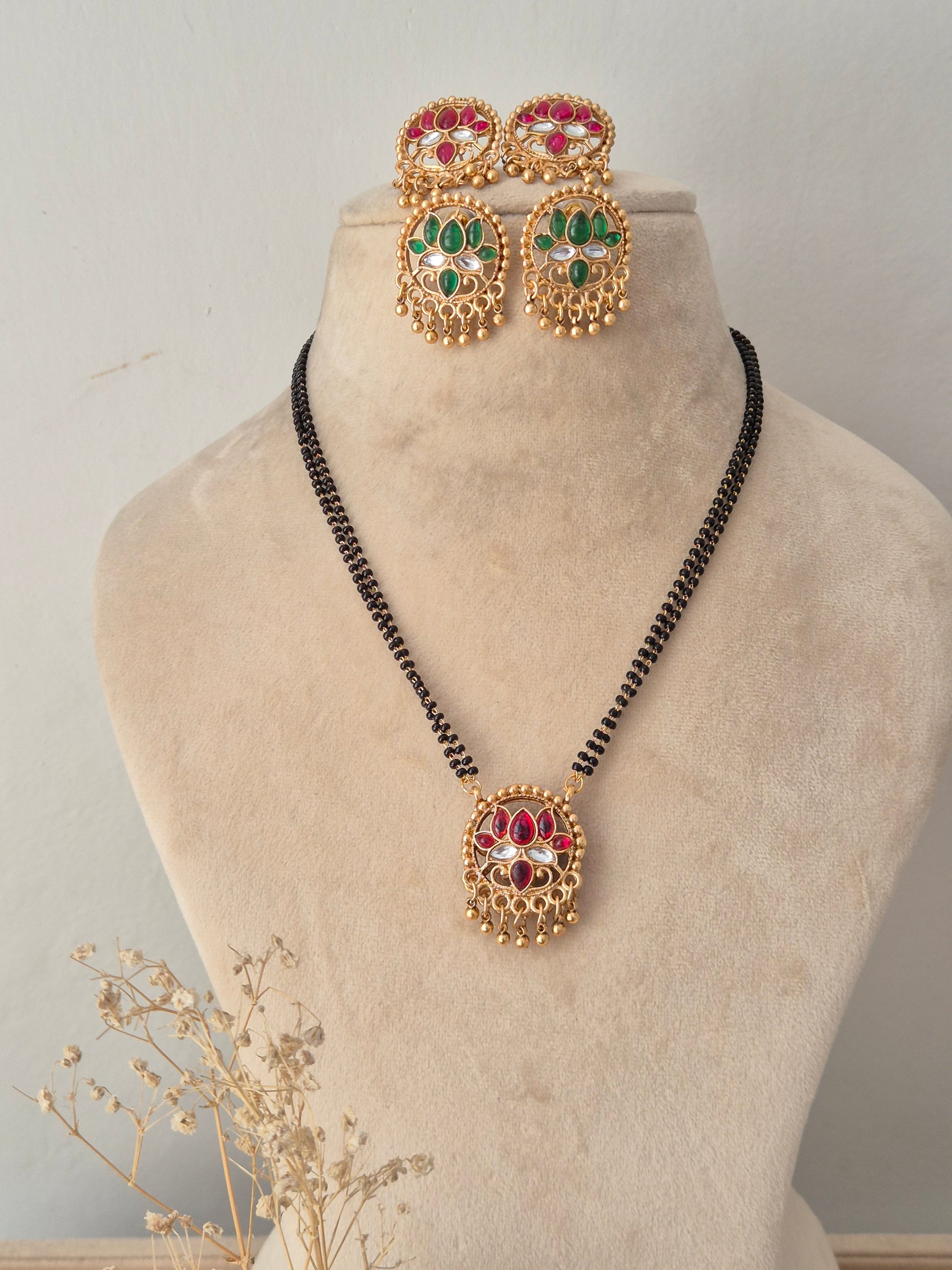 Traditional Reversible Ladita Mangalsutra set featuring a circular red and gold pendant, matching earrings, and a black-beaded chain