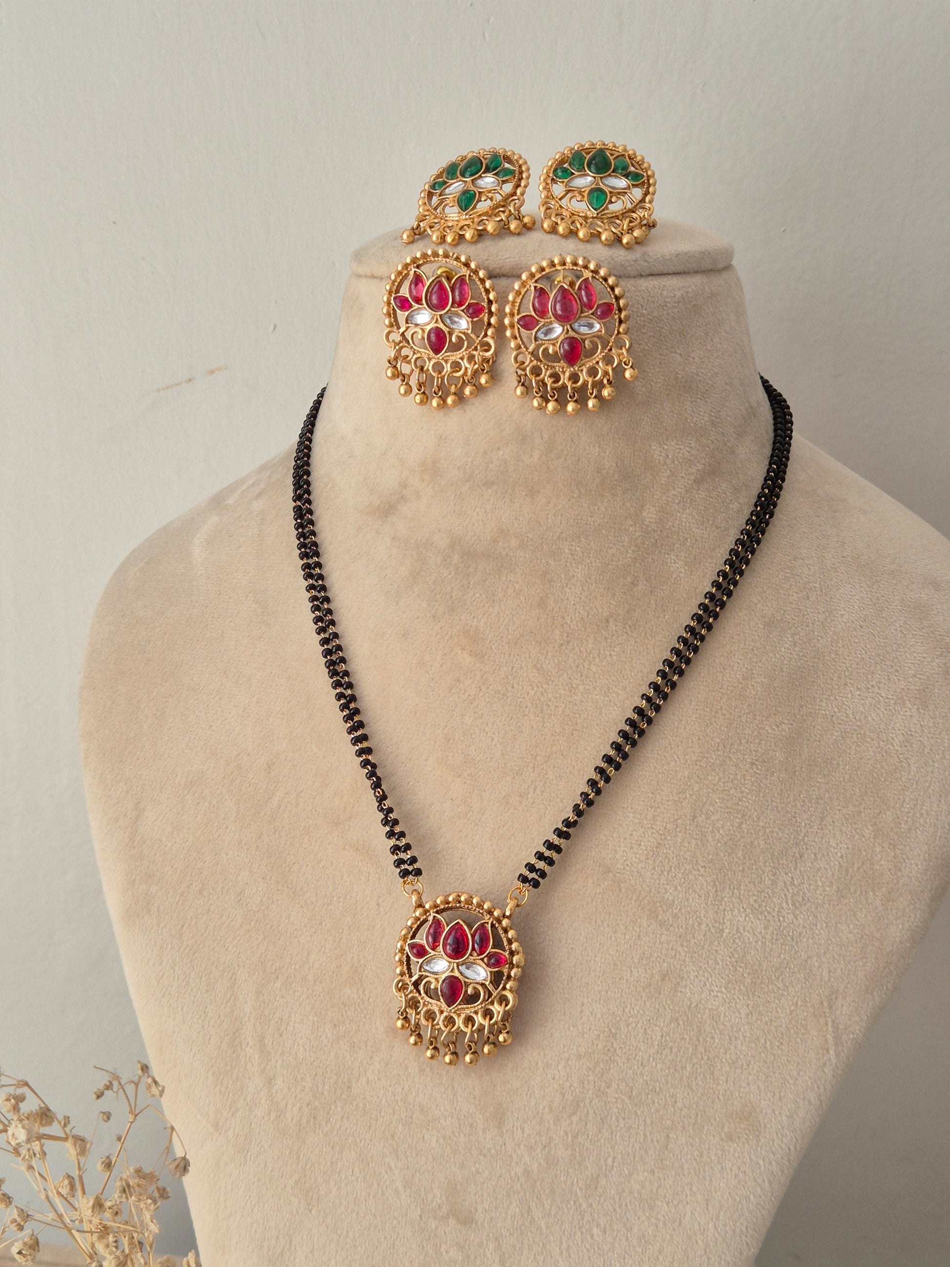 Reversible Ladita Mangalsutra set with round pink stone pendant, matching earrings, and black beads chain by Naitri