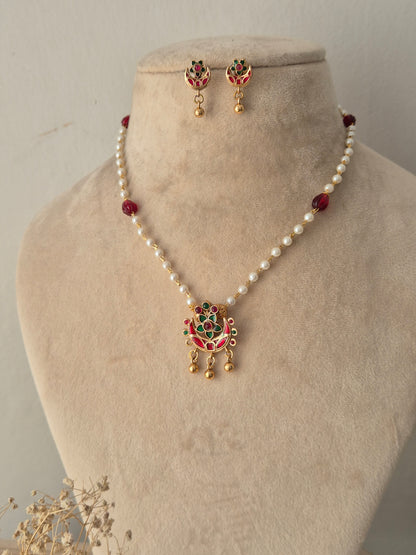Aloka Necklace Set gold red and green stone pendant with white pearl chain and matching earrings by Naitri