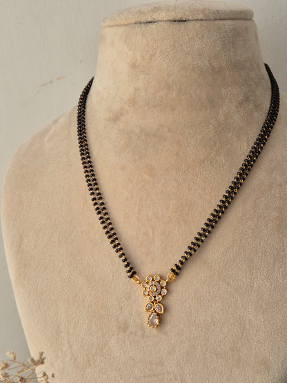 Chetasi Mangalsutra gold floral CZ pendant with black beads chain by Naitri