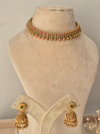 Alpana Choker Necklace Set antique gold temple jewelry choker with pink green stones and matching jhumka earrings by Naitri