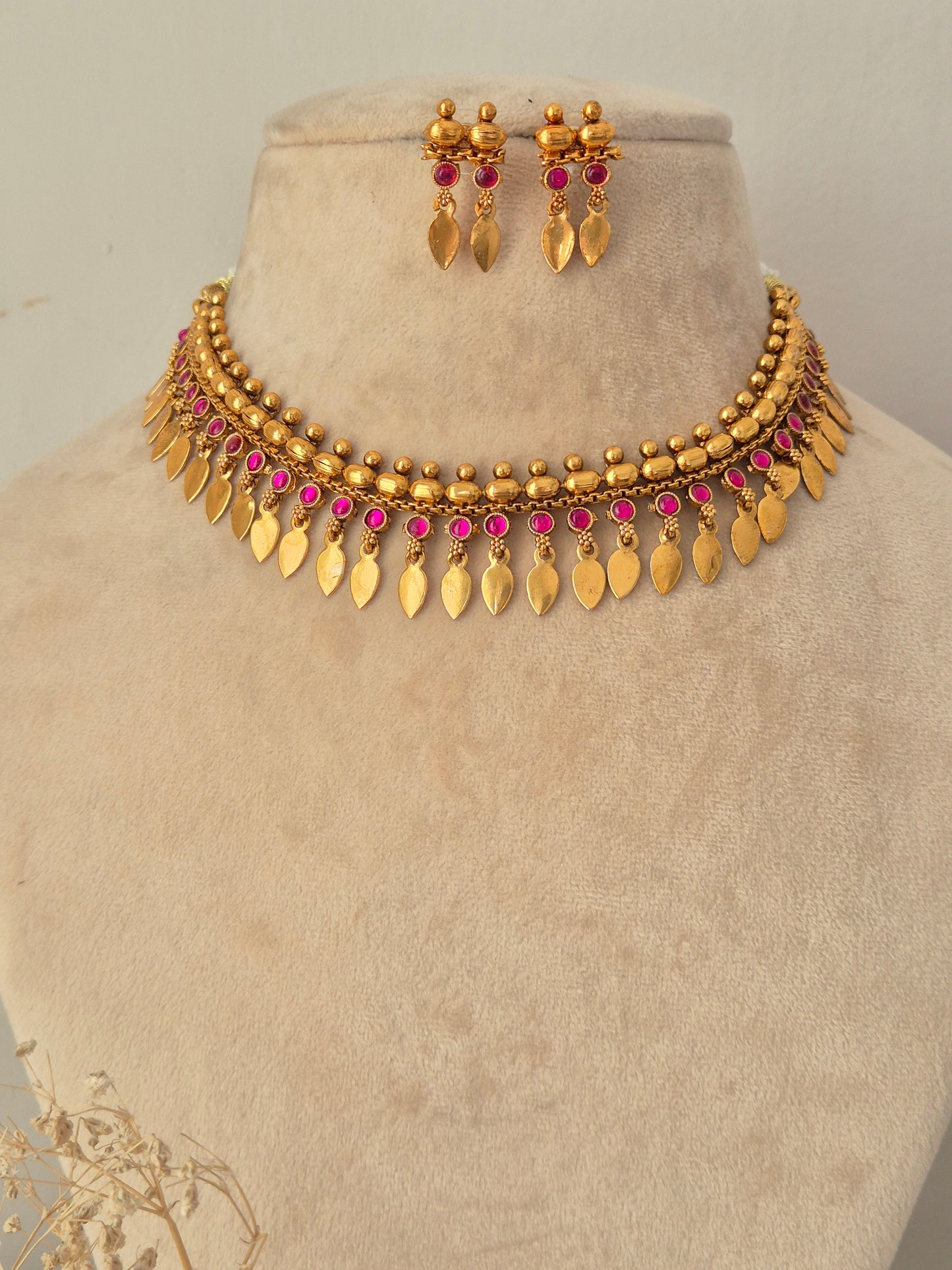 Pahal Necklace Set antique gold choker with pink stones, leaf drops, and matching earrings by Naitri