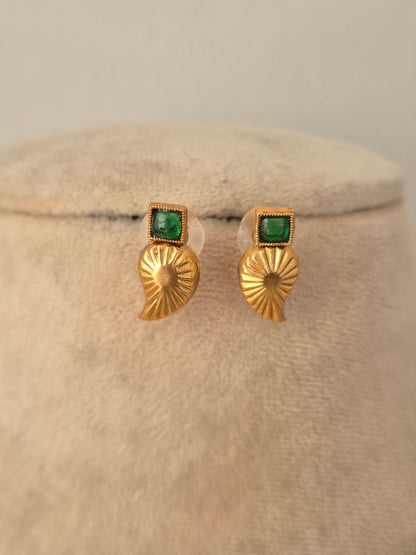 Pair of antique gold drop earrings with square green stone tops and textured leaf-shaped pendants from the Tanvika Necklace Set.