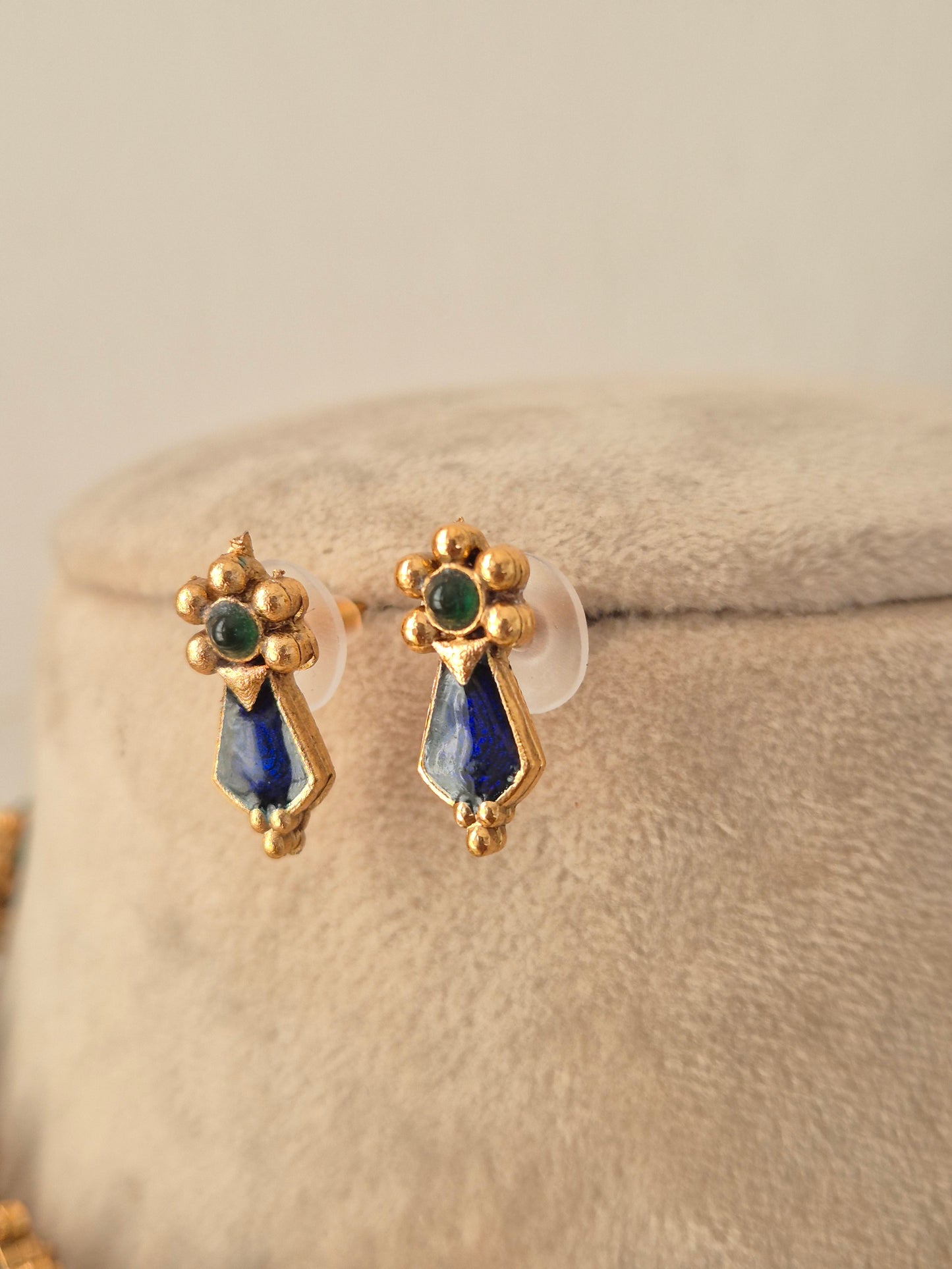 Pair of gold stud earrings with round green stone centers and blue geometric pendants matching the Ehsaas Necklace Set