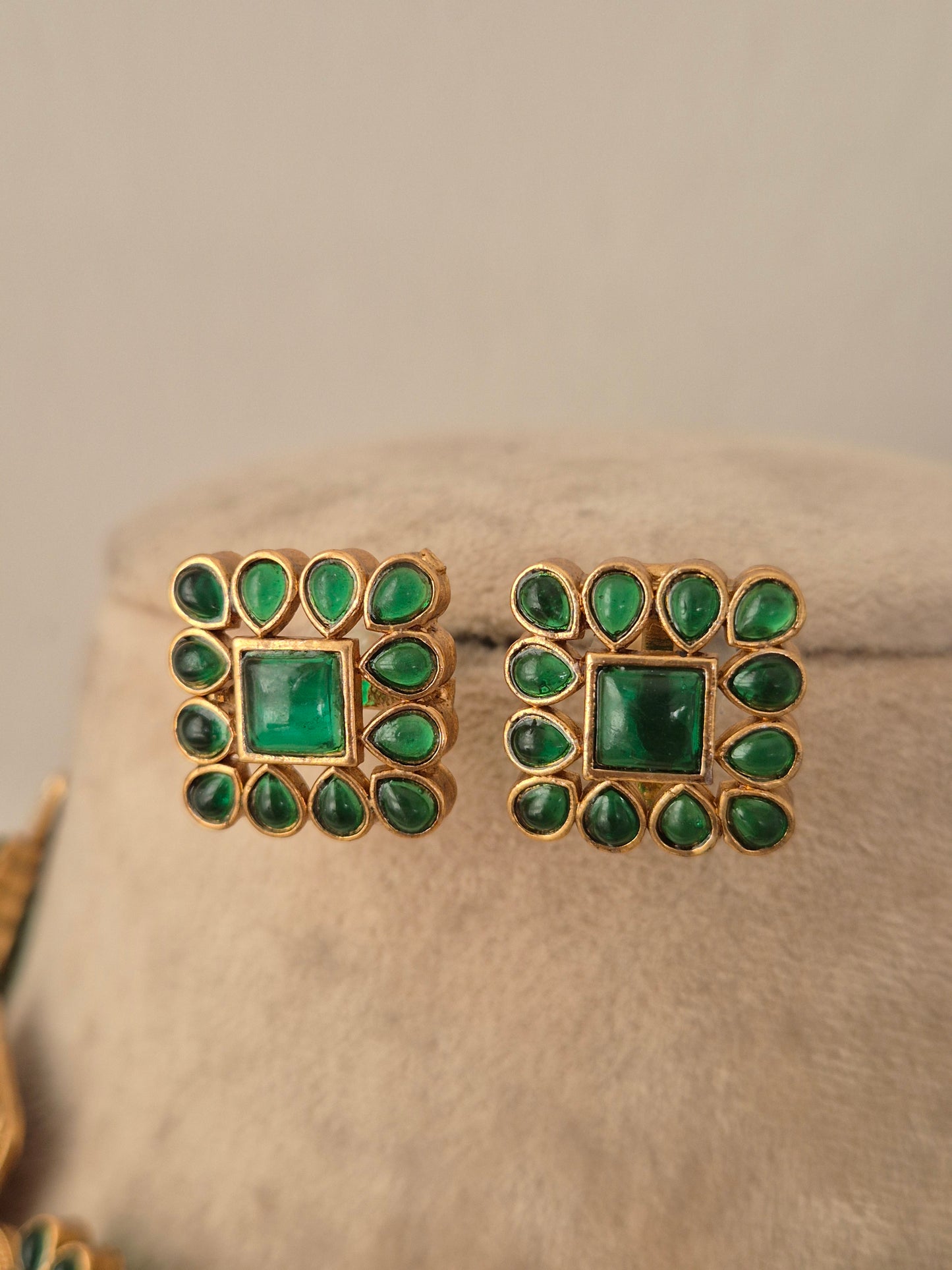 Pair of square antique gold stud earrings with green CZ stone clusters matching the Lambika Necklace Set