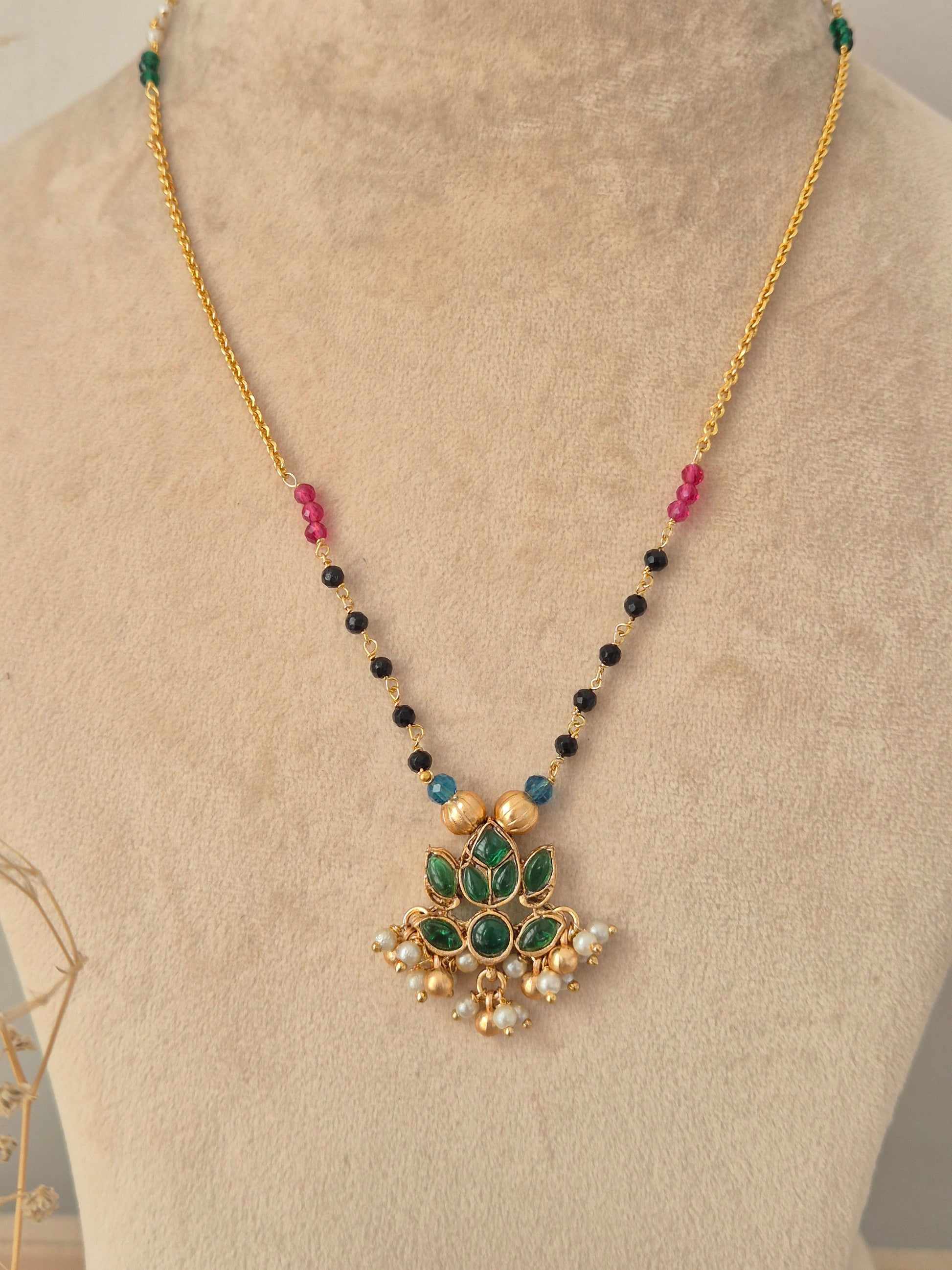 Prabhati Necklace Set gold chain with green stone lotus pendant and matching stud earrings by Naitri