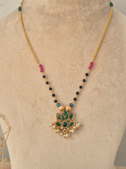Prabhati Necklace Set gold chain with green stone lotus pendant and matching stud earrings by Naitri