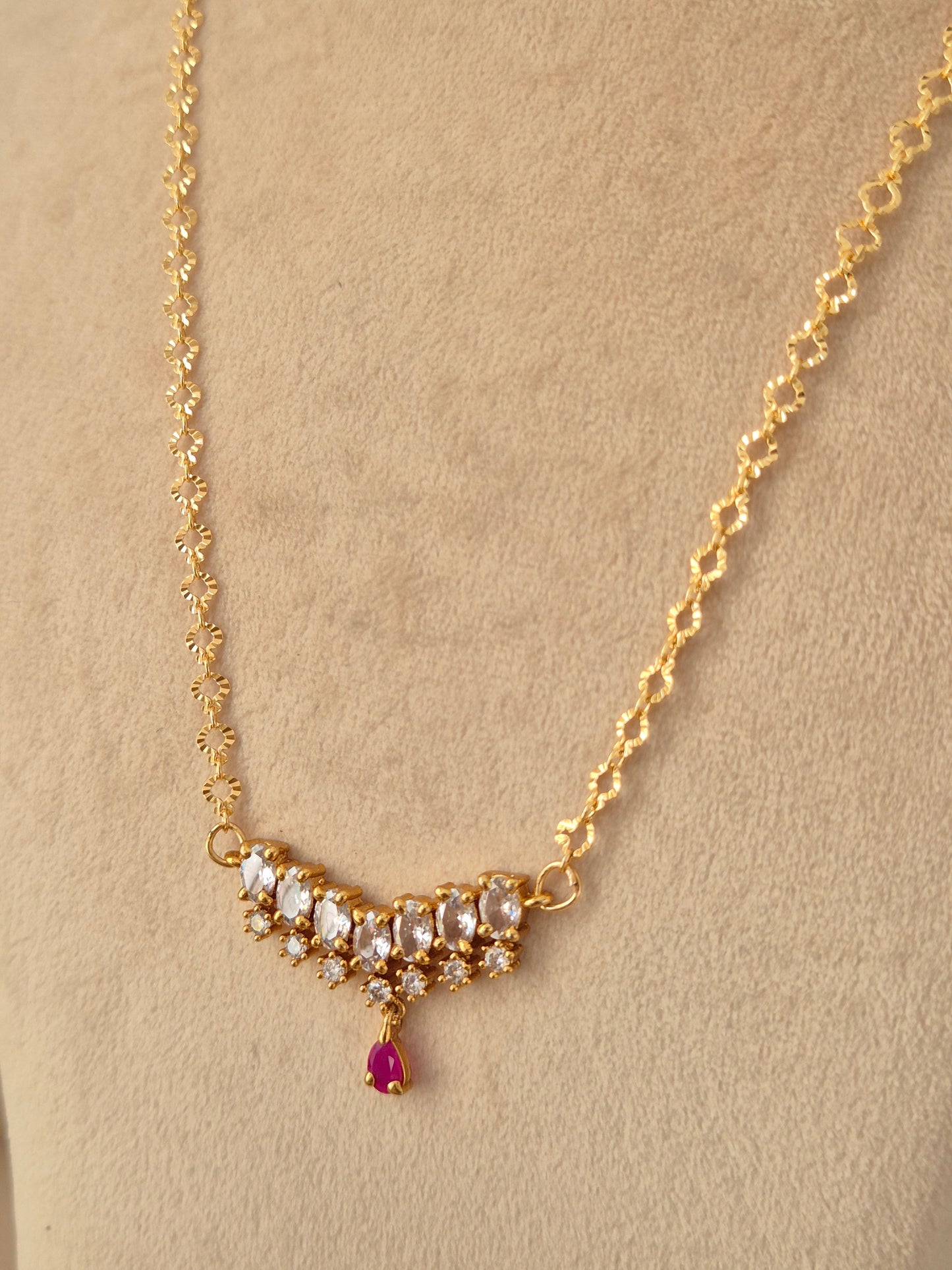 Zaahra Necklace gold chain with clear CZ stones and ruby-pink teardrop pendant drop by Naitri