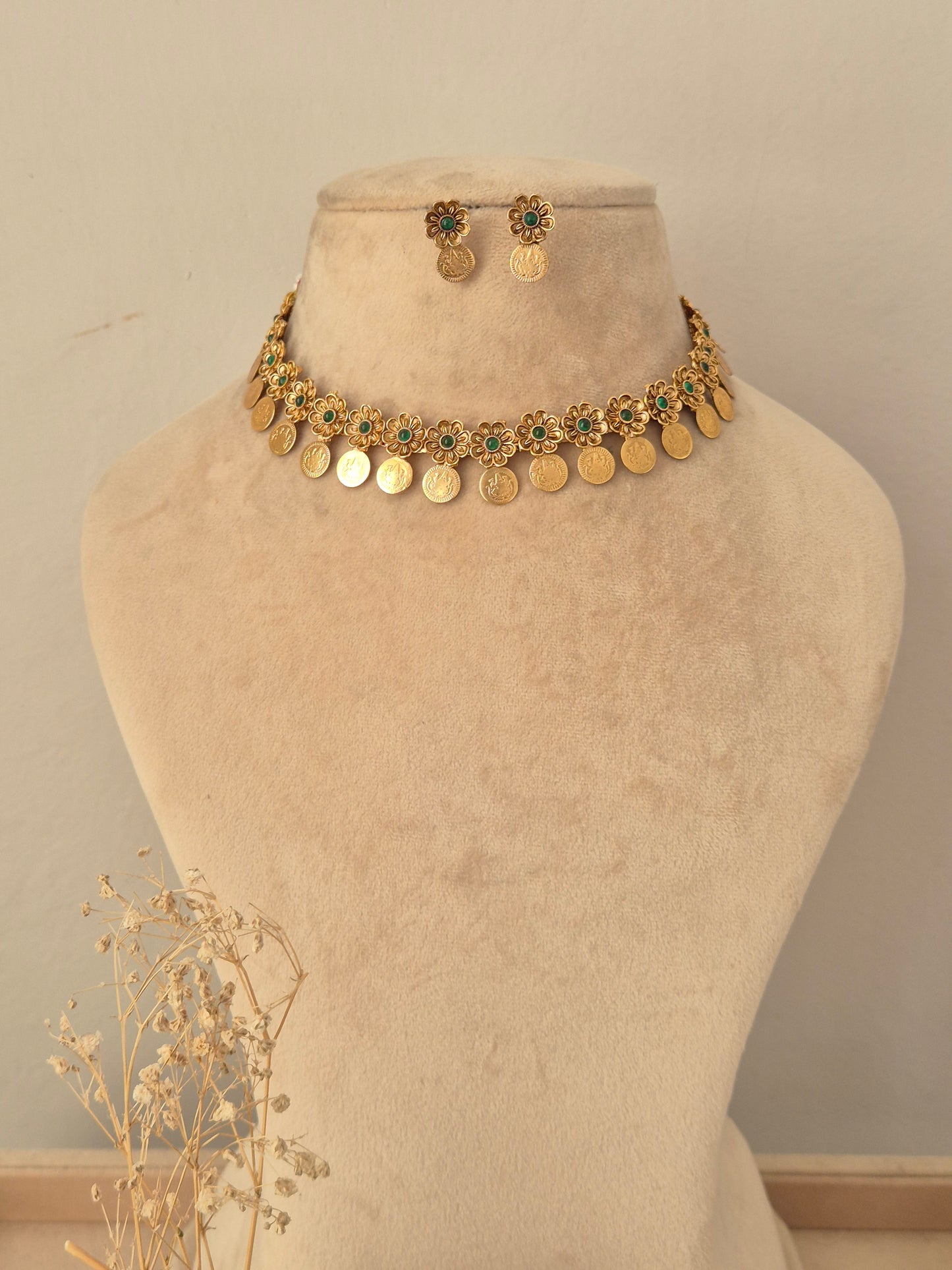Zoyna Necklace Set featuring a gold coin choker necklace with floral green stone motifs and matching drop earrings