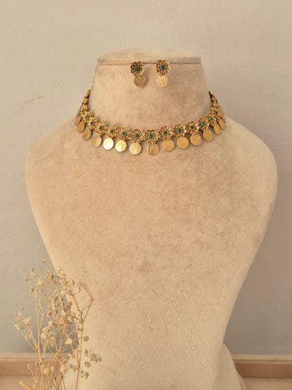 Zoyna Necklace Set featuring a gold coin choker necklace with floral green stone motifs and matching drop earrings