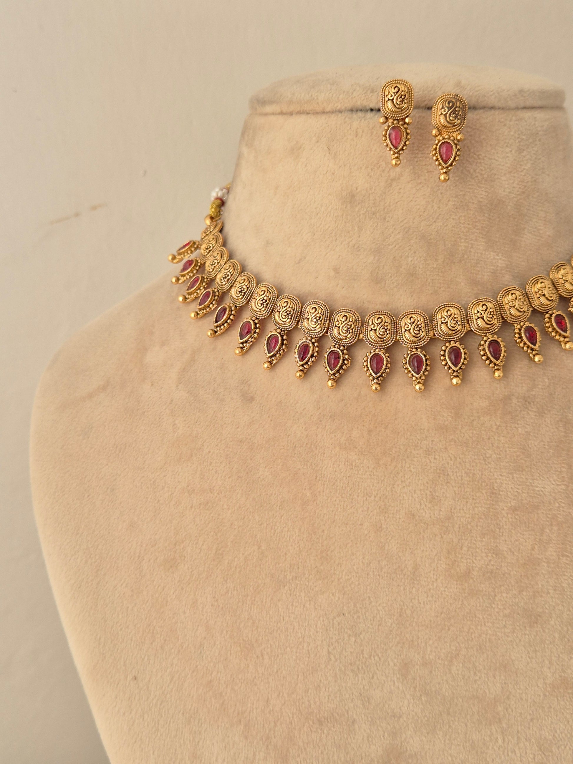 Antique gold choker necklace with teardrop ruby-pink stone pendants and small stud earrings