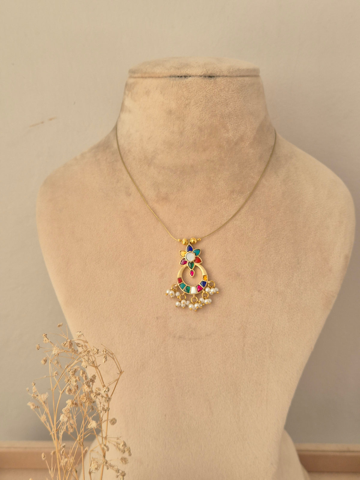 Traditional antique gold broad choker necklace featuring ruby-pink stone clusters and matching teardrop stud earrings