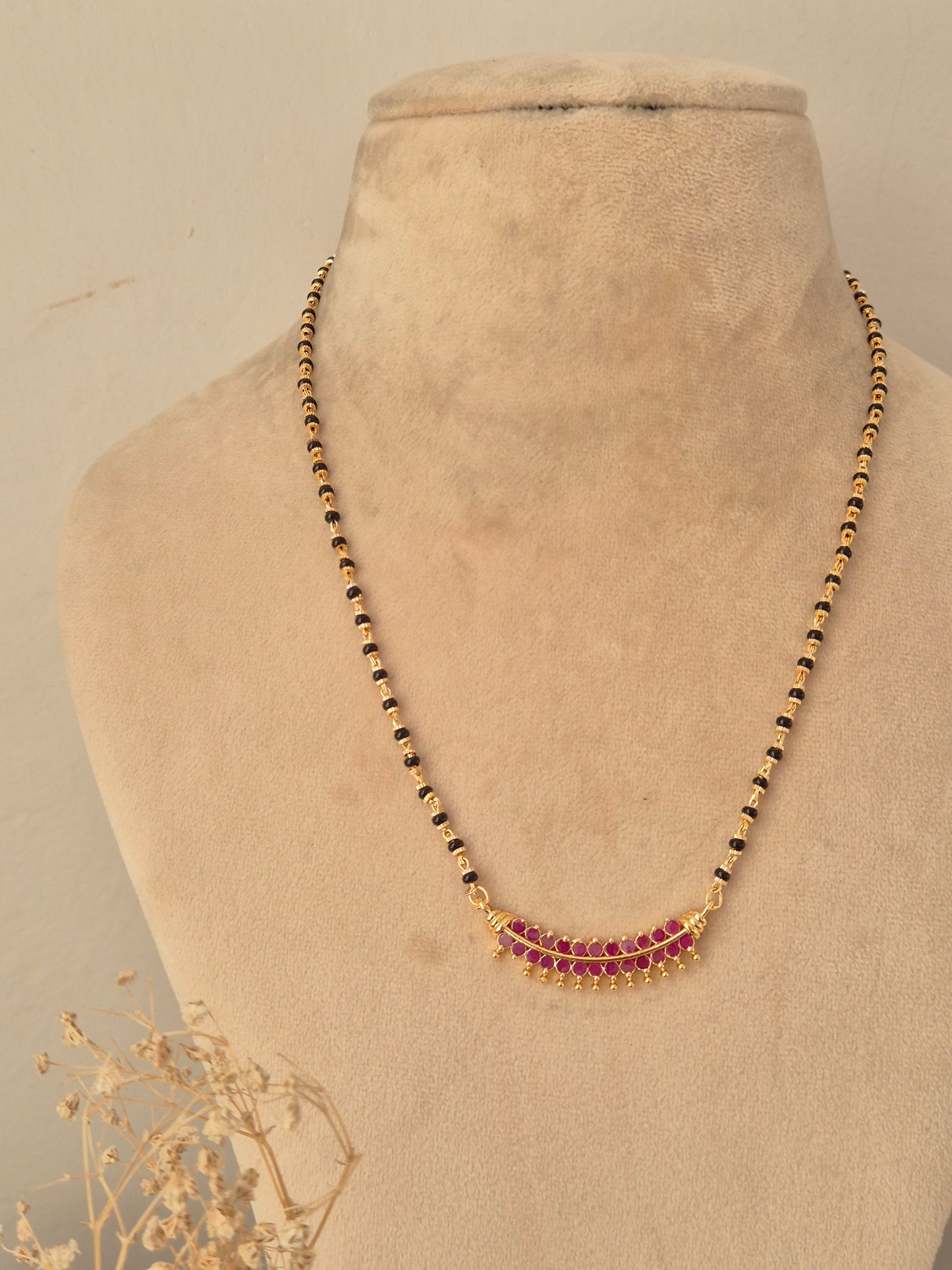 Antique gold-plated long black bead mangalsutra set with ruby-pink stone pendant