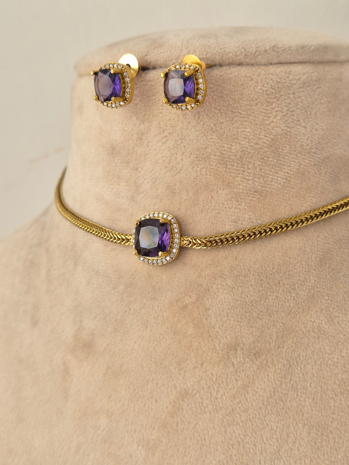Antique gold-plated long black bead mangalsutra set with ruby-pink stone floral pendant and coordinating earrings