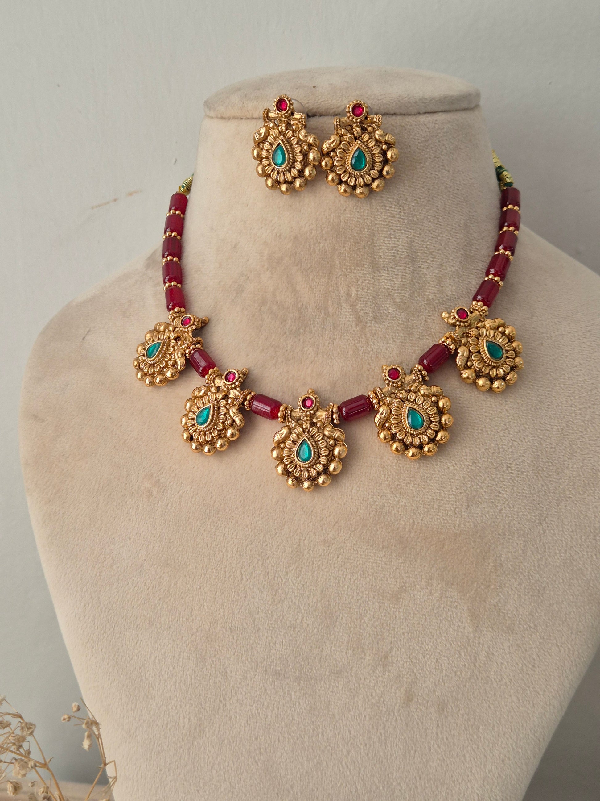 Antique gold and ruby-red beaded necklace set with turquoise stone pendants and matching stud earrings
