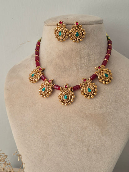 Antique gold and ruby-red beaded necklace set with turquoise stone pendants and matching stud earrings