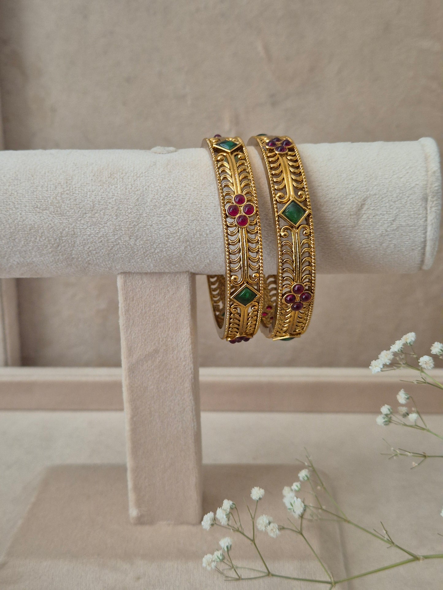 gold bangles set of 2 with red and green stones by naitri.in