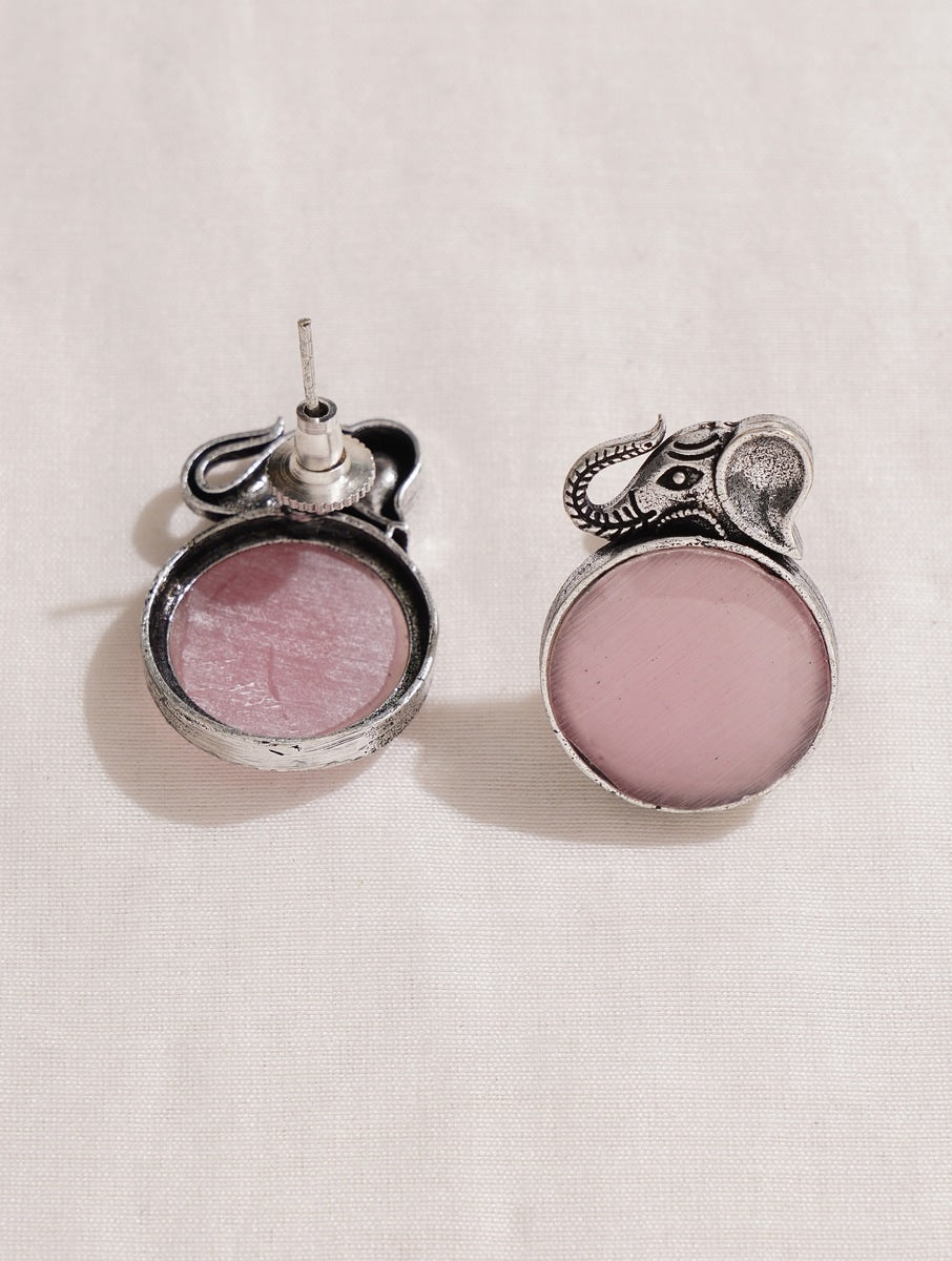 Pink and silver necklace, earrings, ring set on soft background