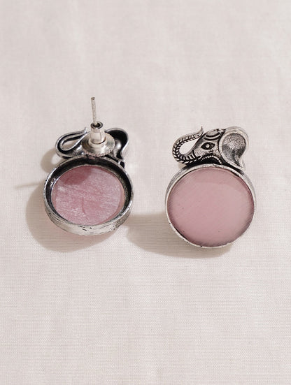 Pink and silver necklace, earrings, ring set on soft background