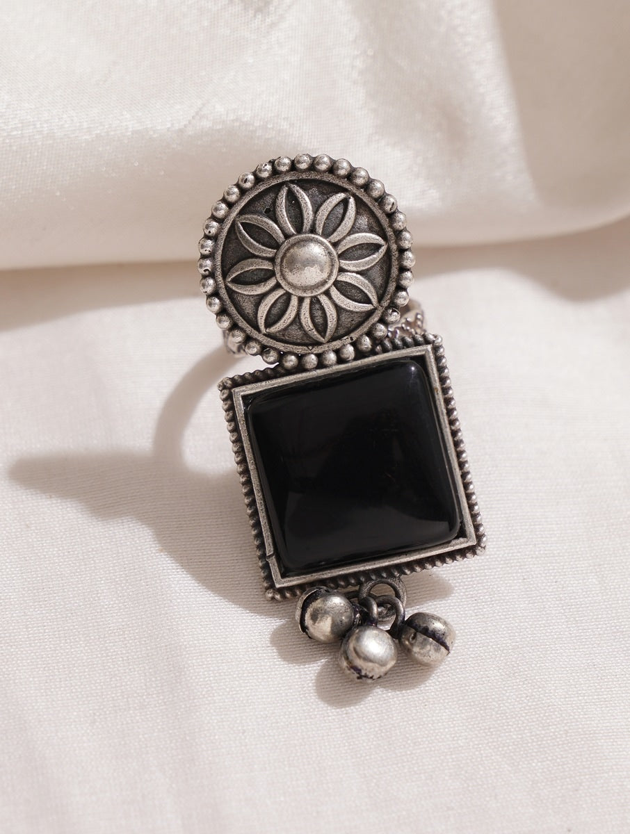 Silver band oxidized ring, close-up accent on handmade texture