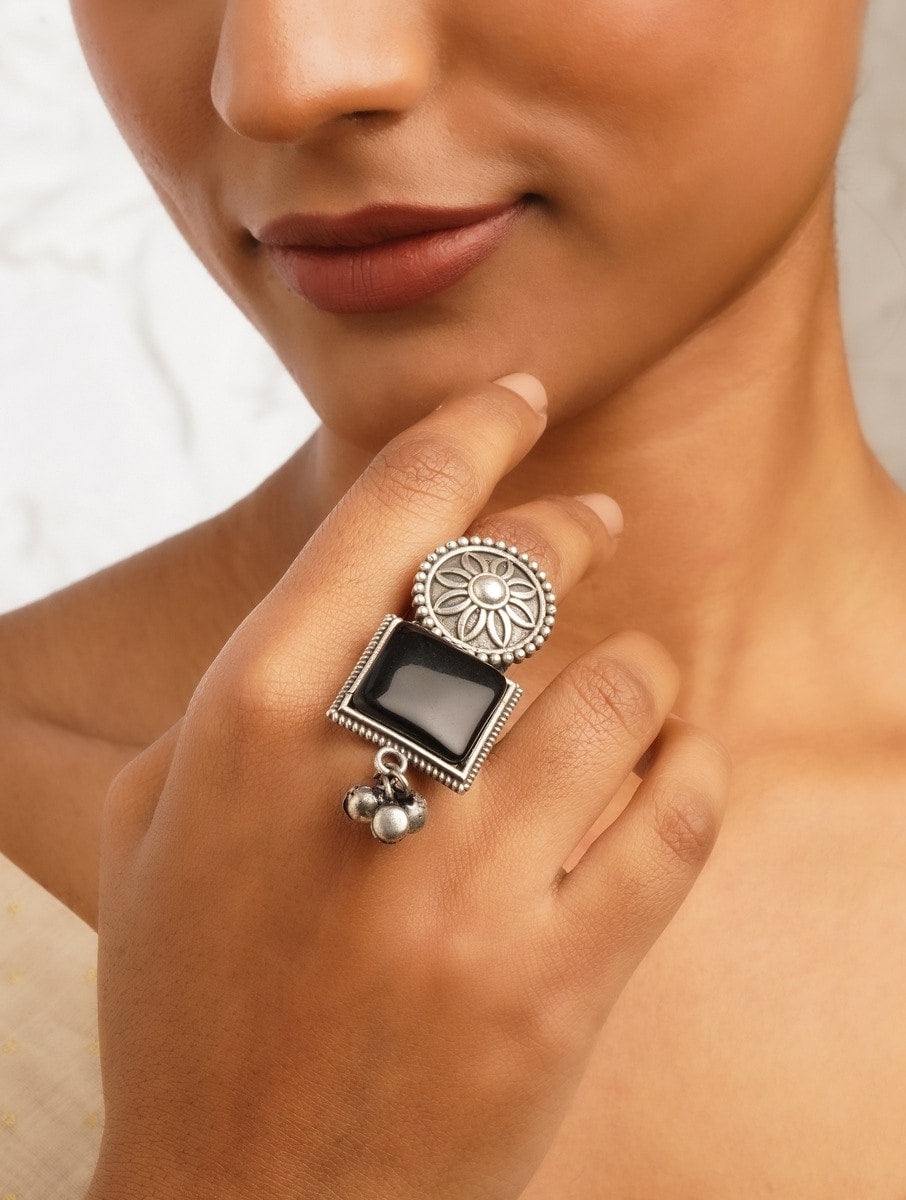 Silver band oxidized ring, close-up accent on handmade texture