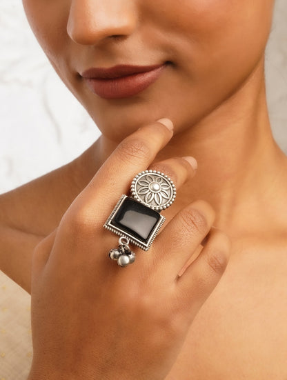 Silver band oxidized ring, close-up accent on handmade texture